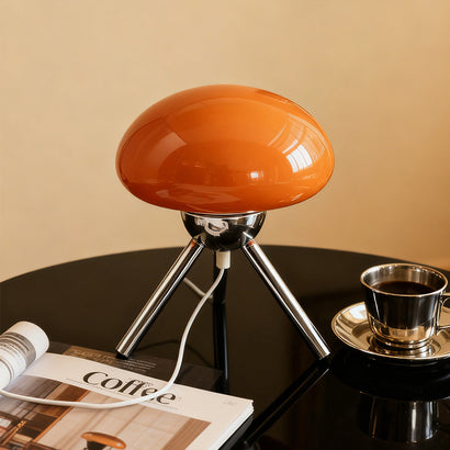 Mushroom-shaped glass table lamp with metal tripod base, bedroom bedside ambient light