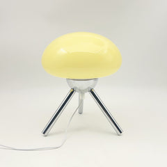 Mushroom-shaped glass table lamp with metal tripod base, bedroom bedside ambient light